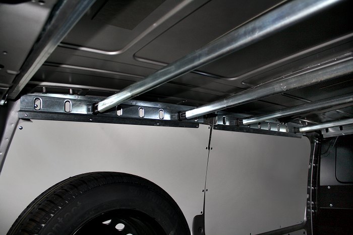 Metal bars locked onto bars for Syncro Canada vans