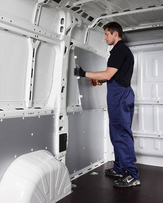 Installation of paneling on a van by Syncro Canada